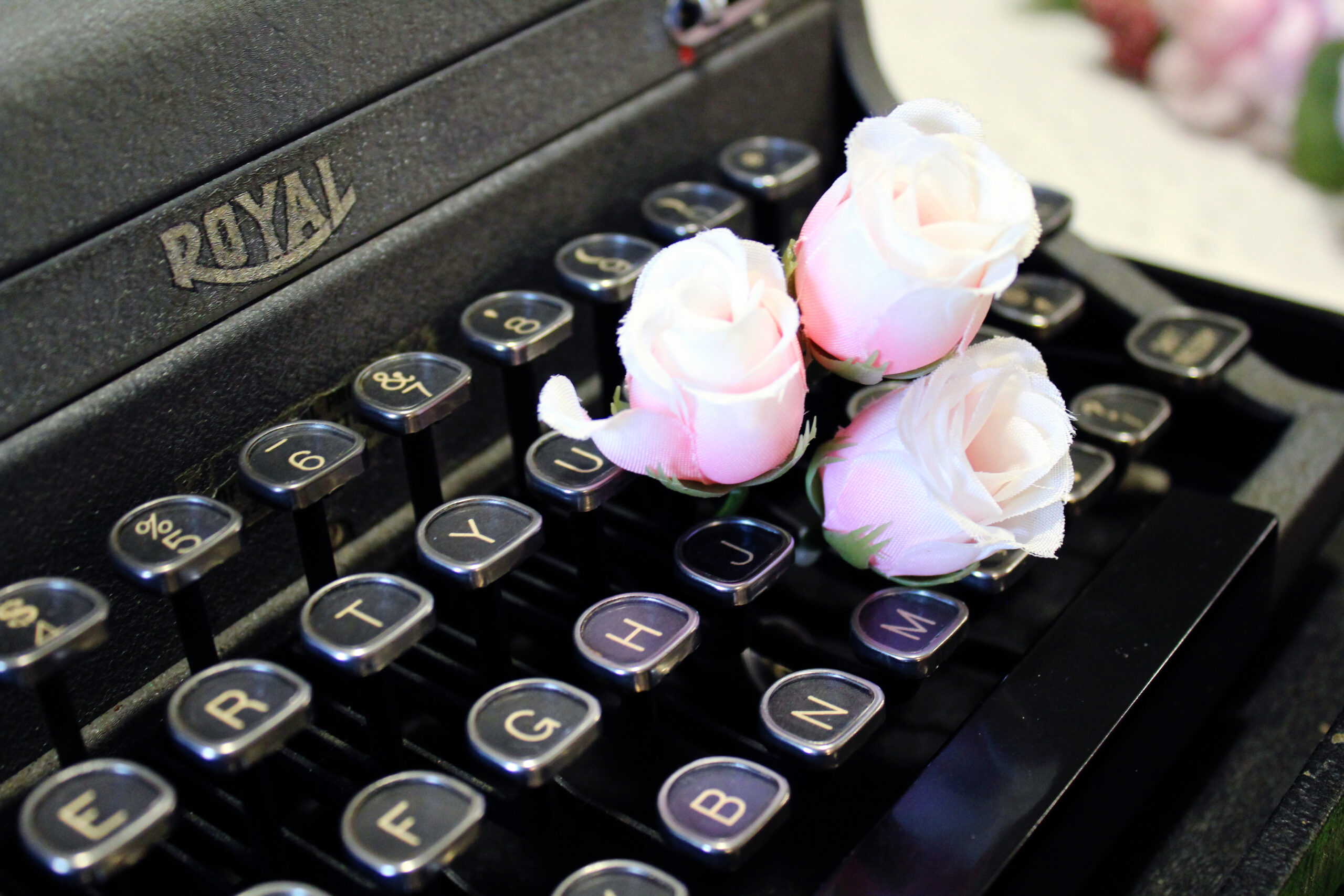 Typewriter with flowers in keys